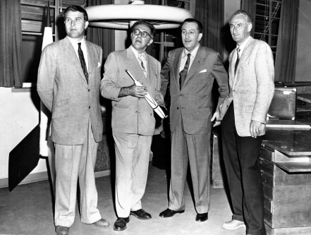 Walt Disney, second from right, joins von Braun and colleagues in July 1954 during work on a series of educational television programs about space ...