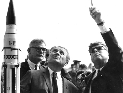 With von Braun as host and escort, President John F. Kennedy gestures during his second visit ...