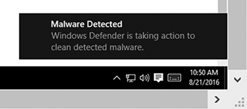 Screenshot shows a message, “Malware Detected, ‘Windows Defender is taking action to clean detected malware” in a prompt box.