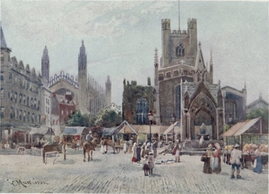 MARKET SQUARE This picture represents what is called Half Market, which takes place on Wednesday. Market day, properly speaking, is on Saturday, when the square is filled with stalls. The church is Great St. Mary’s, and King’s College Chapel is seen in the distance on the left.