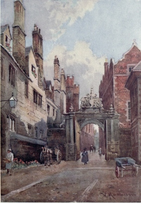 NEVILE’S GATE, TRINITY COLLEGE To the left are the College kitchens and on the right is Bishop’s Hostel. The buildings on the left are among the most ancient in this college. Through the picturesque old gateway we see up the lane into Trinity Street.