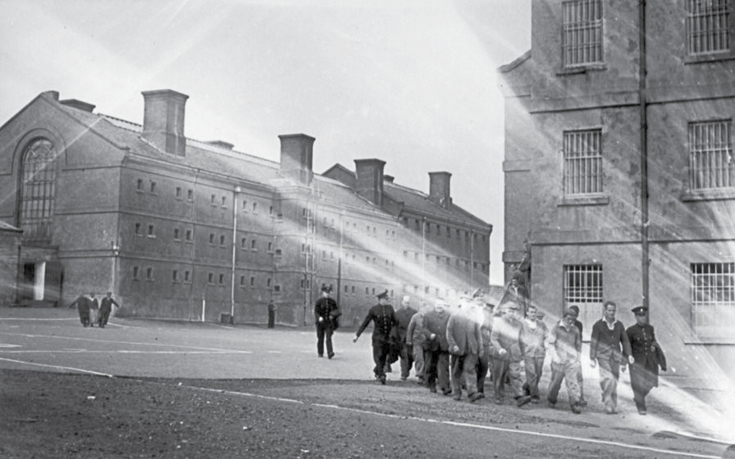 Under guard, a work party leaves Peterhead Prison, mid-1930s.