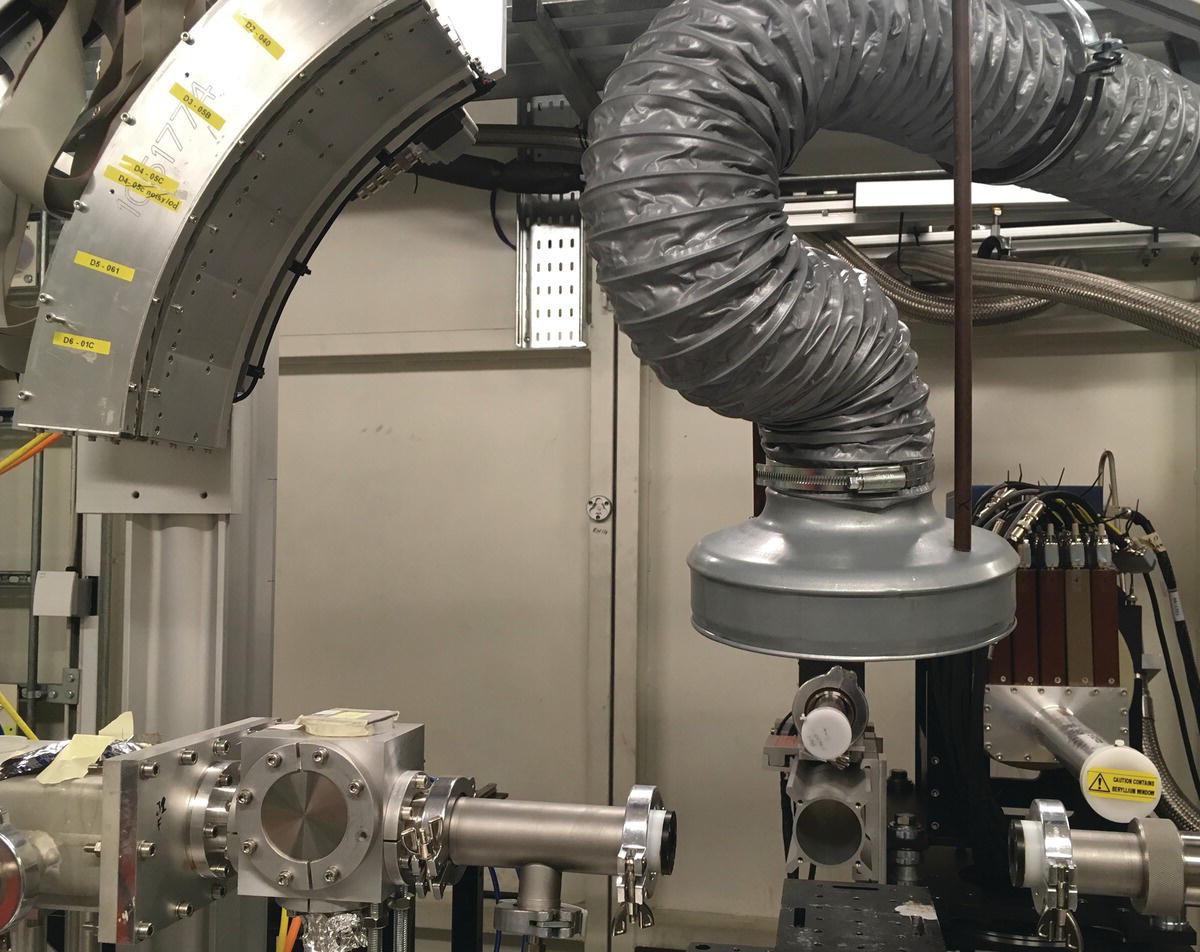 Photo displaying the installation of a curved multi‐element solid‐state detector for wide‐angle x‐ray scattering on an XAFS beamline.