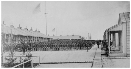 The 26th U.S. Colored Volunteer Infantry on parade, Camp William Penn, Pennsylvania, 1865. In June 1863, the United States Army established Camp William Penn for training units of the United States Colored Troops. The photograph also shows a neatly constructed rendezvous camp, something that became more common as the war progressed as stables on fairgrounds gave way to purpose-built barracks for sheltering recruits. (National Archives)