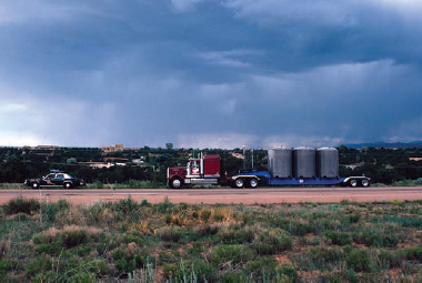 Donald Woodman, WIPP Transport Truck with New Mexico Police Escort, 1989. © Donald Woodman.