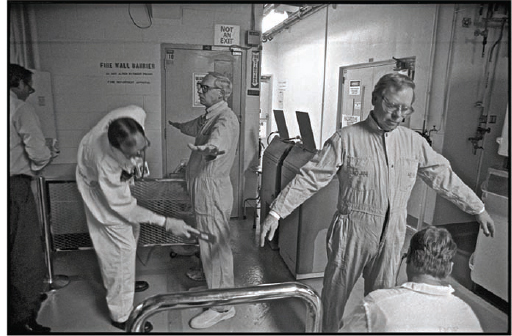 Robert Del Tredici, Radiation-safety technicians check workers John Bower...