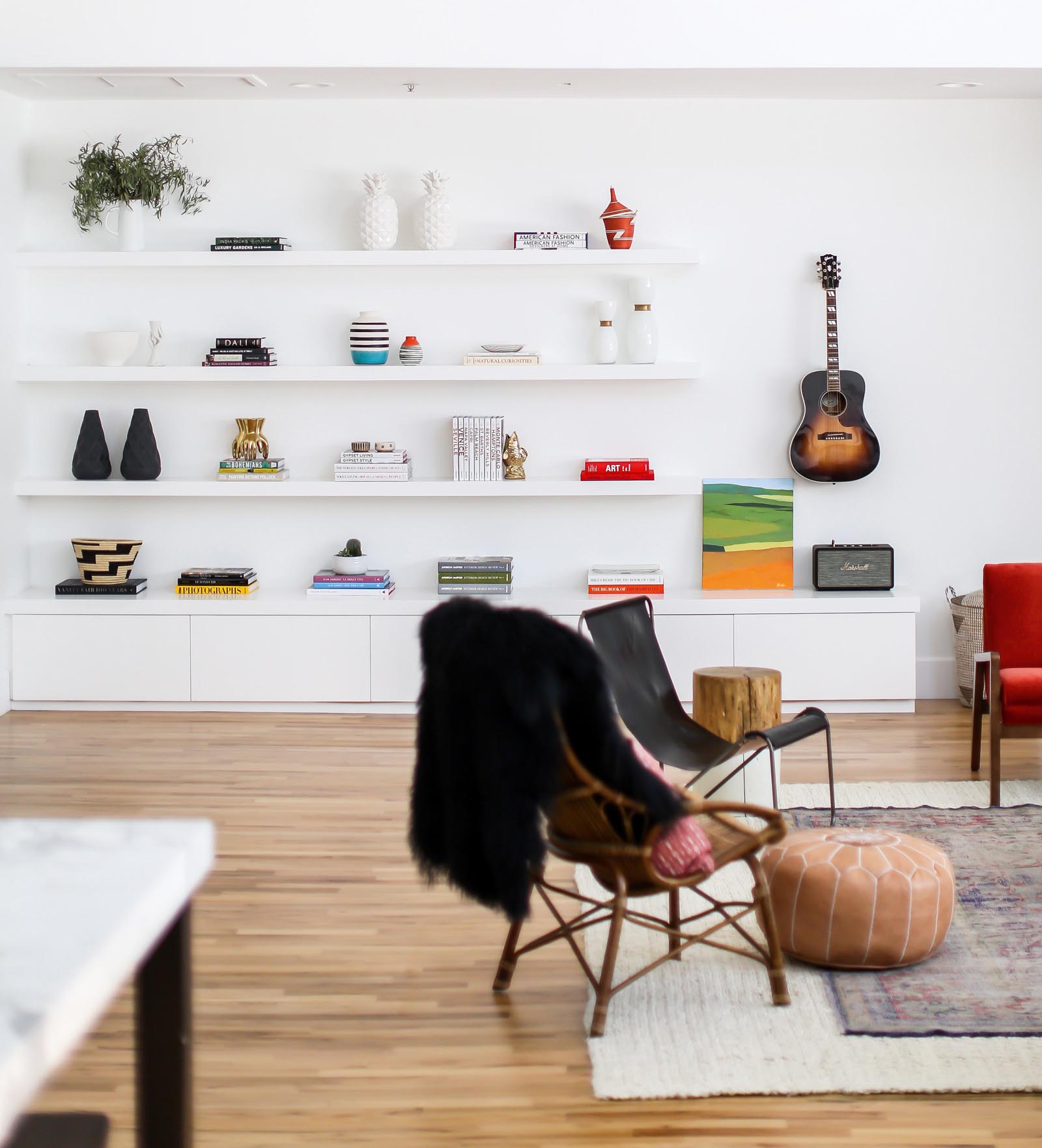 Custom shelving displays some of the extensive collection of books and art pieces.