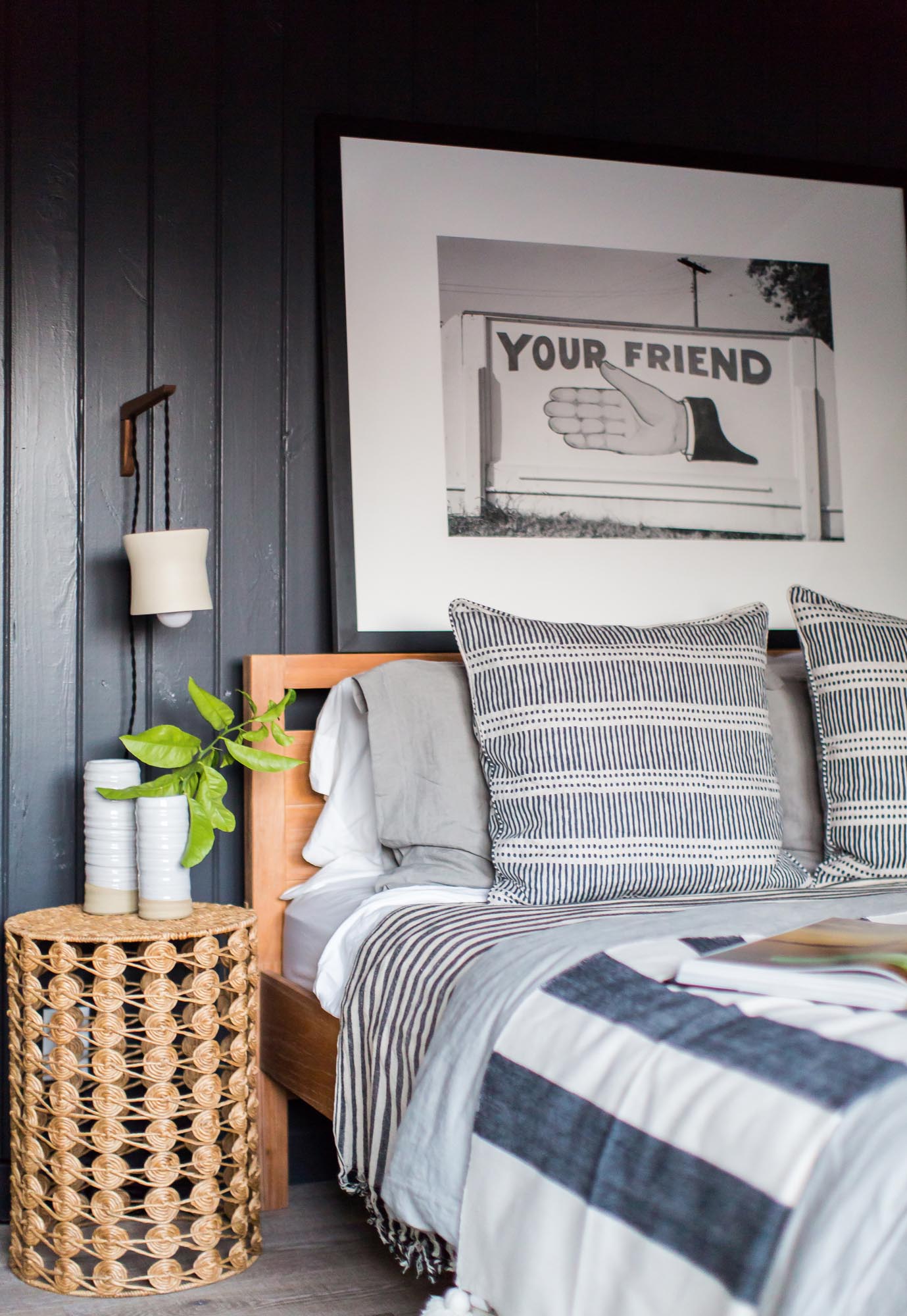 Photo of the head of the bed with a a photo of a "your friend" sign.