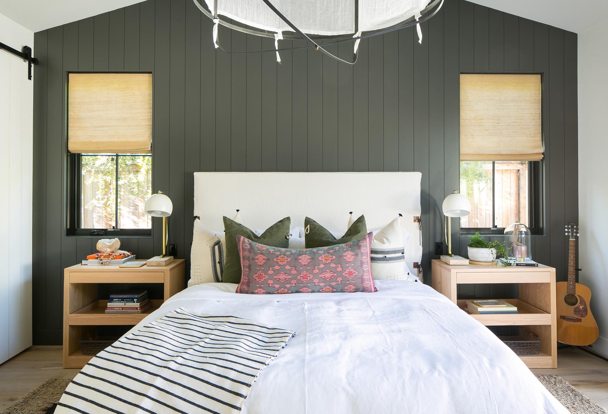 The Benjamin Moore “Jet” black accentuates the master bedroom furnishings.