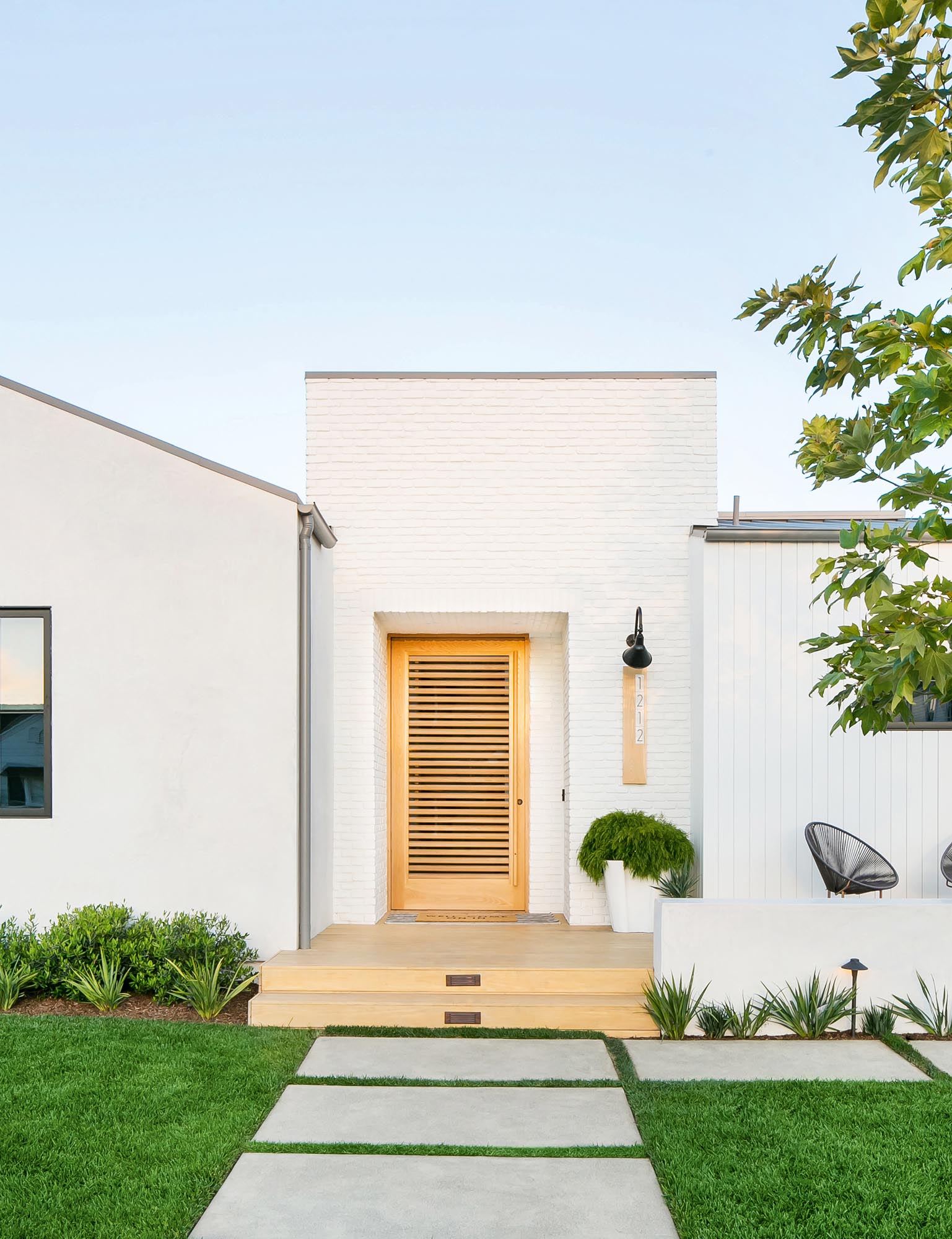 Photo of modern lines and varying textures on the cottage exterior.