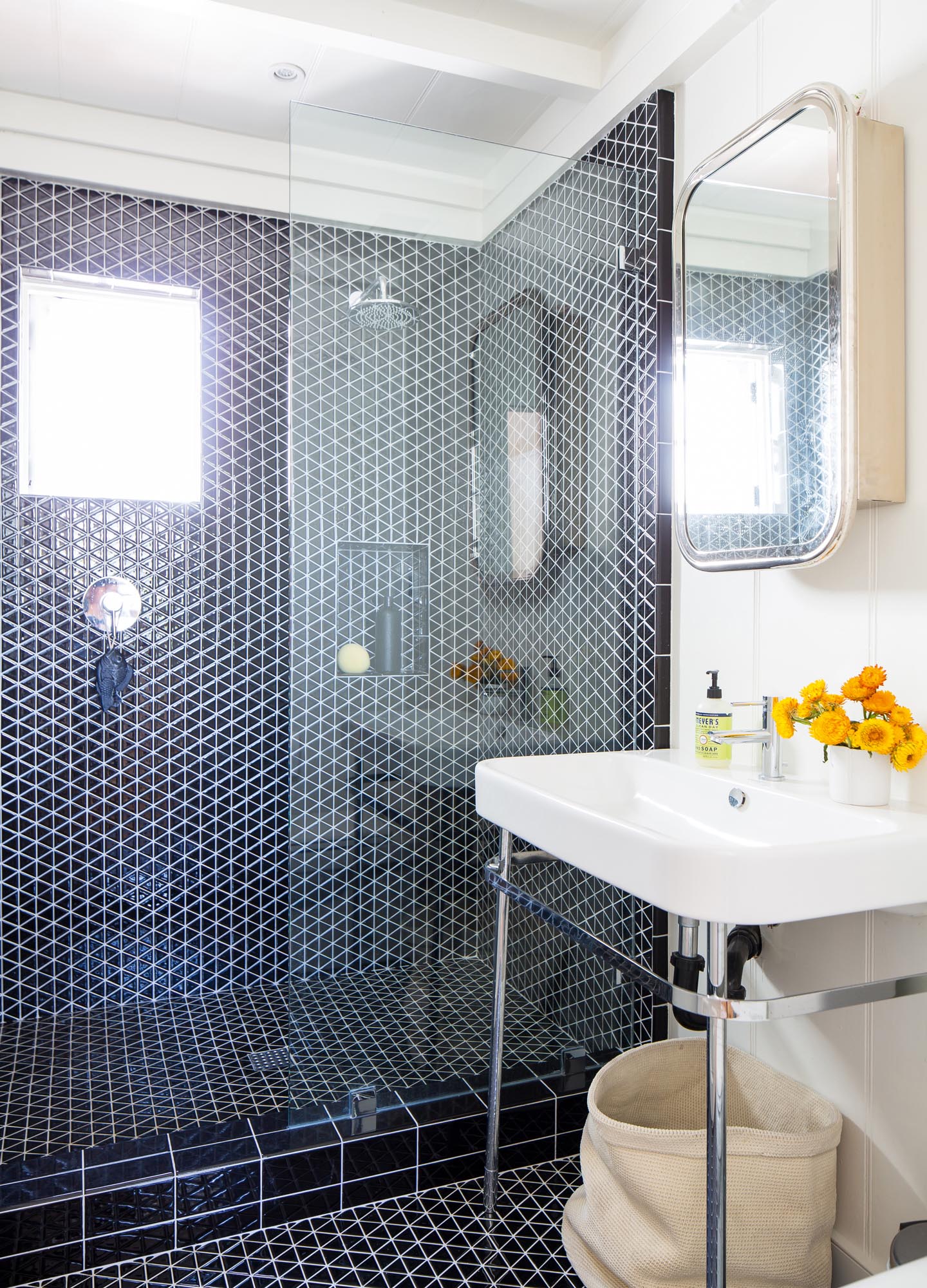 Small black diamond-patterned tile makes a statement in a guest bathroom.