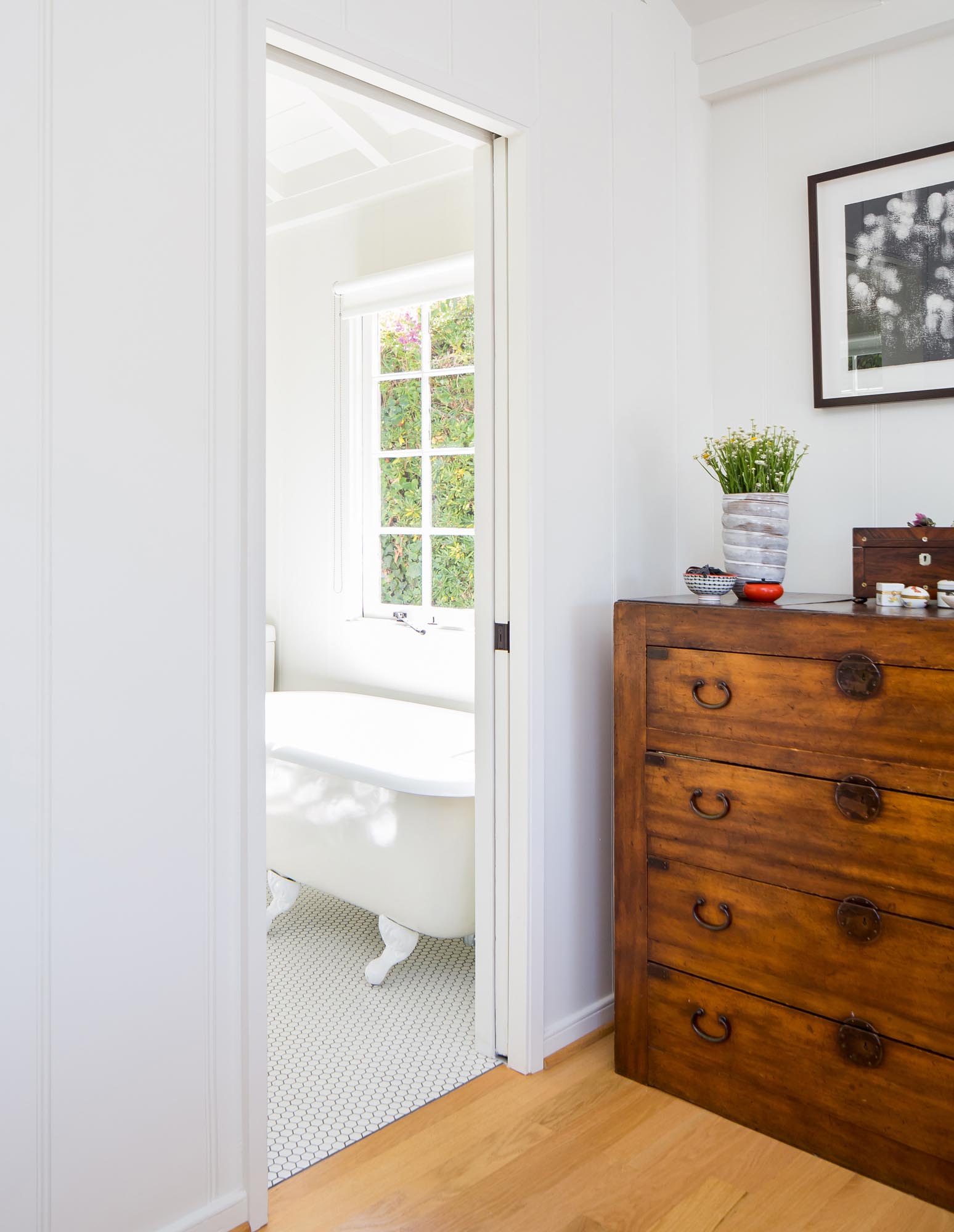 A beautifully crafted nineteenth-century chest sits outside the master bathroom.