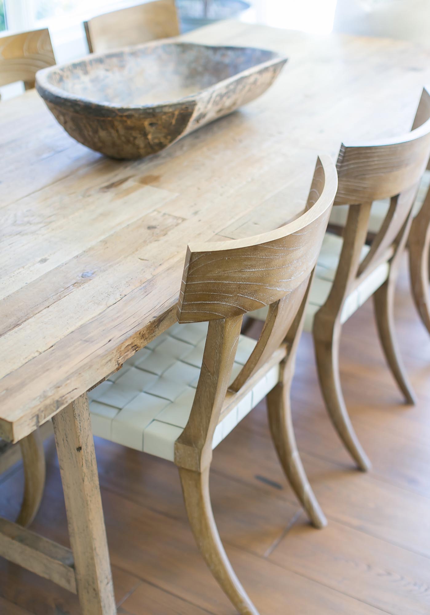 Photo of the natural wood table and dining chairs.