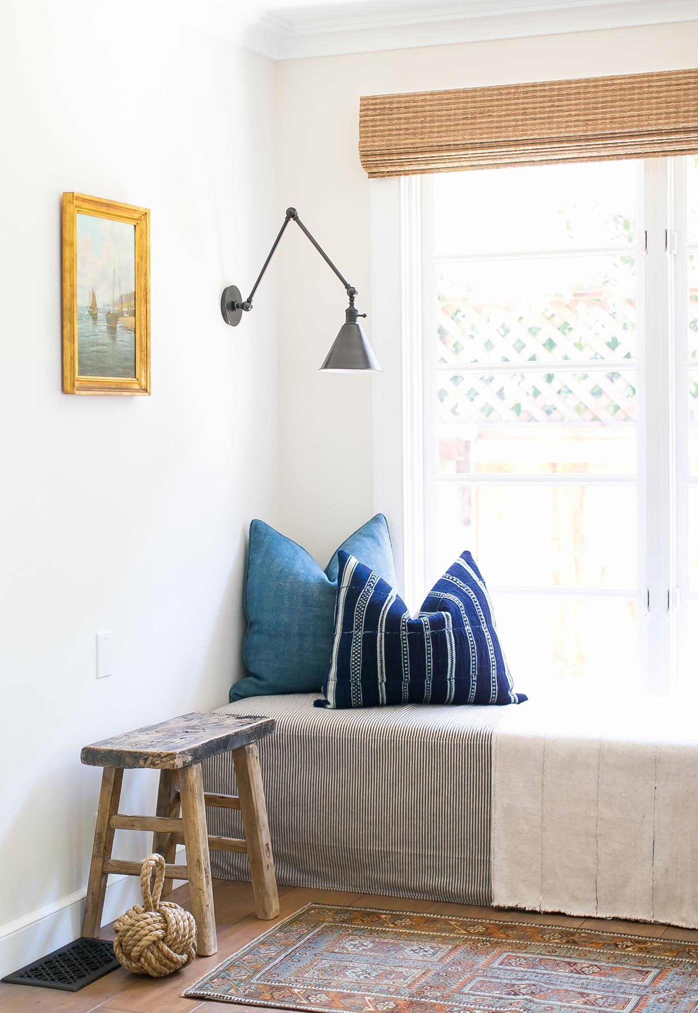 Michelle’s favorite reading nook is completed with custom fabric indigo pillows from the Juxtaposition Home collection.