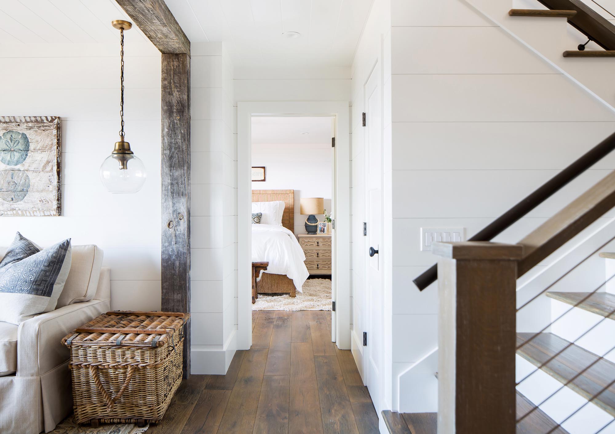 Vintage beams, wide-planked hardwood and an antique basket complement the contemporary look.