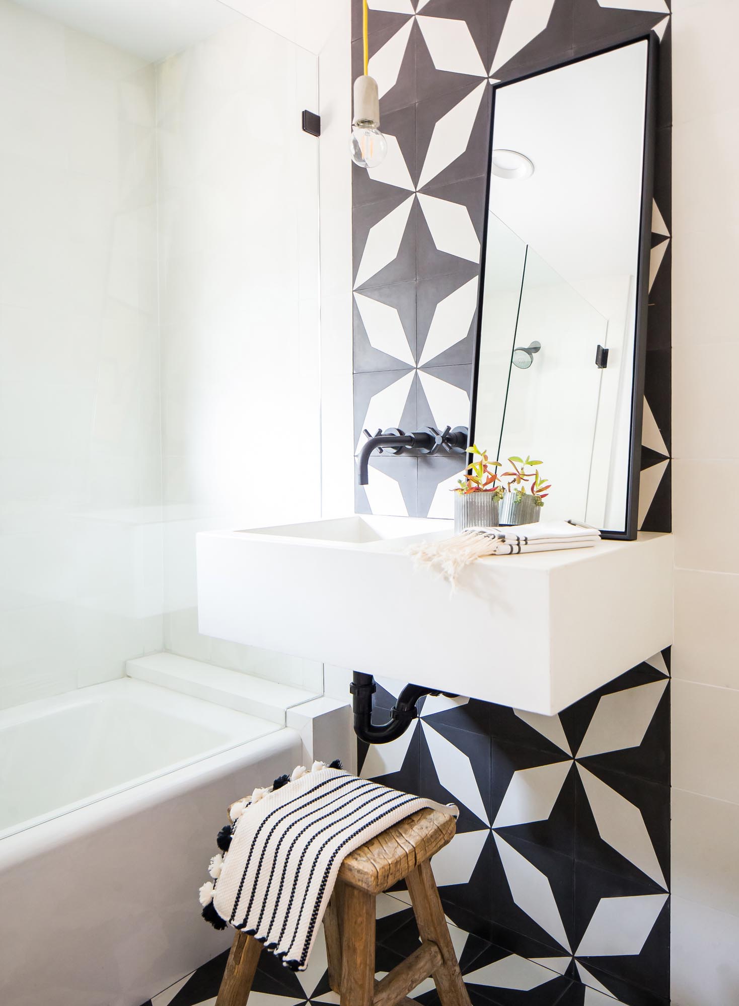 Bathrooms infuse character with a Rorschach-like pattern of stars and diamonds.