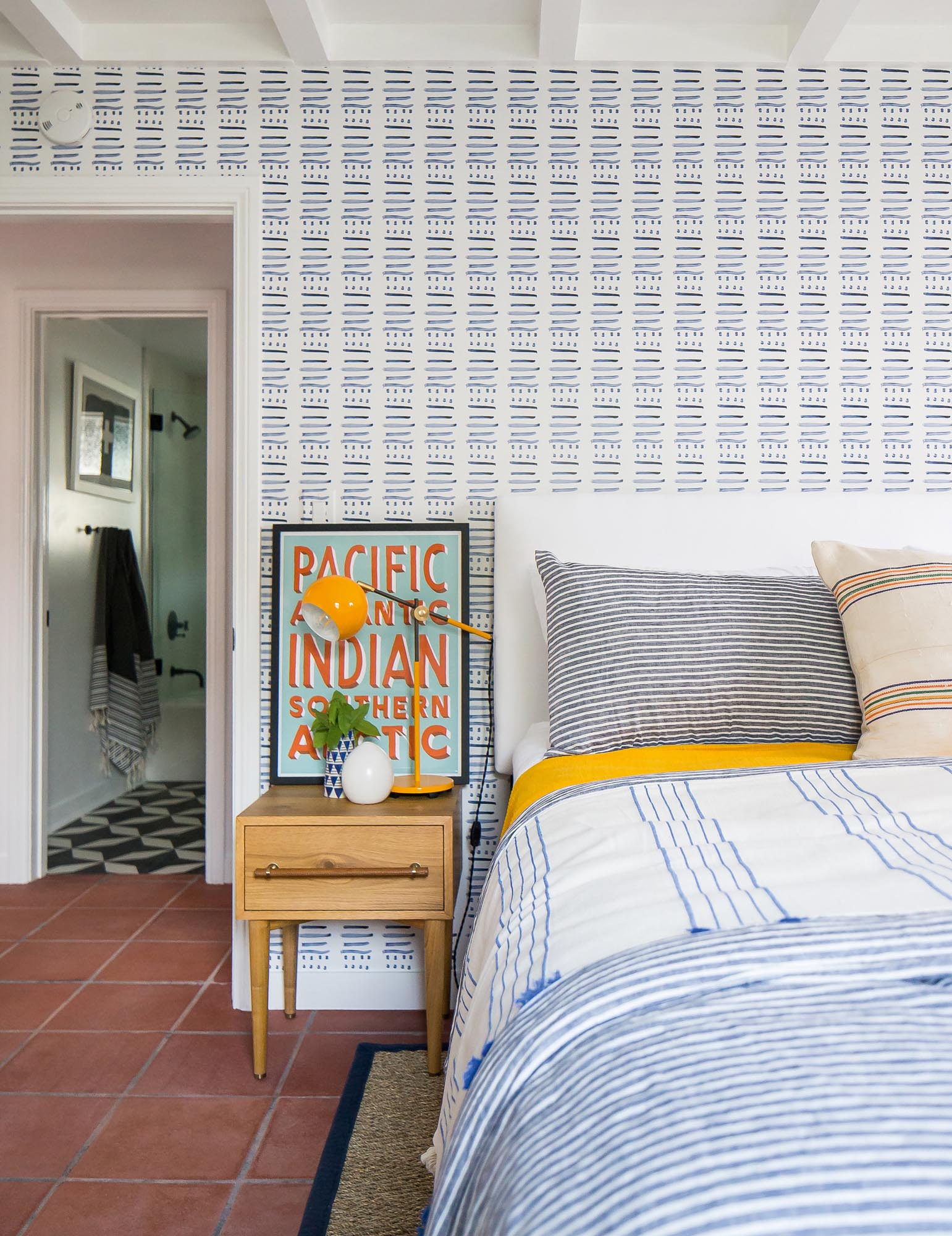 The juxtaposed Kerry Rosenthal-designed wallpaper and complementary bedding reflect the owners’ taste for the diverse cultures explored on their global travels.