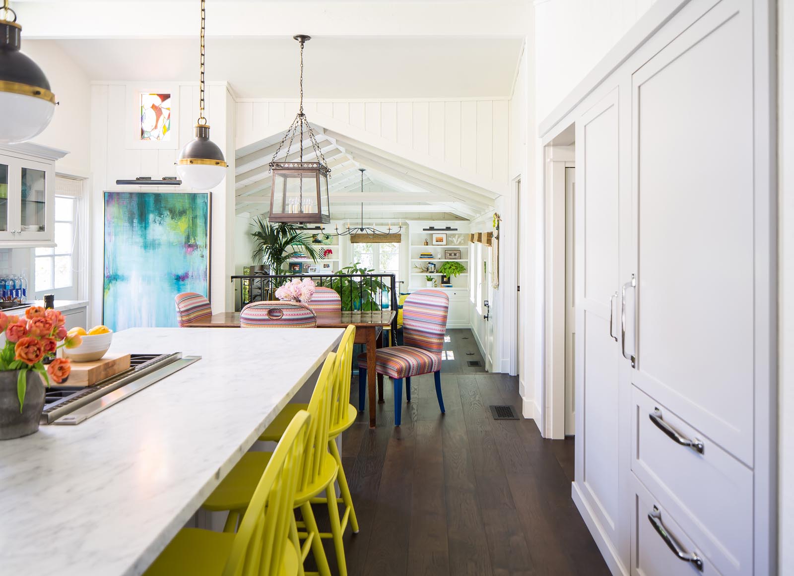 The open kitchen and dining area is a panoply of color and style.