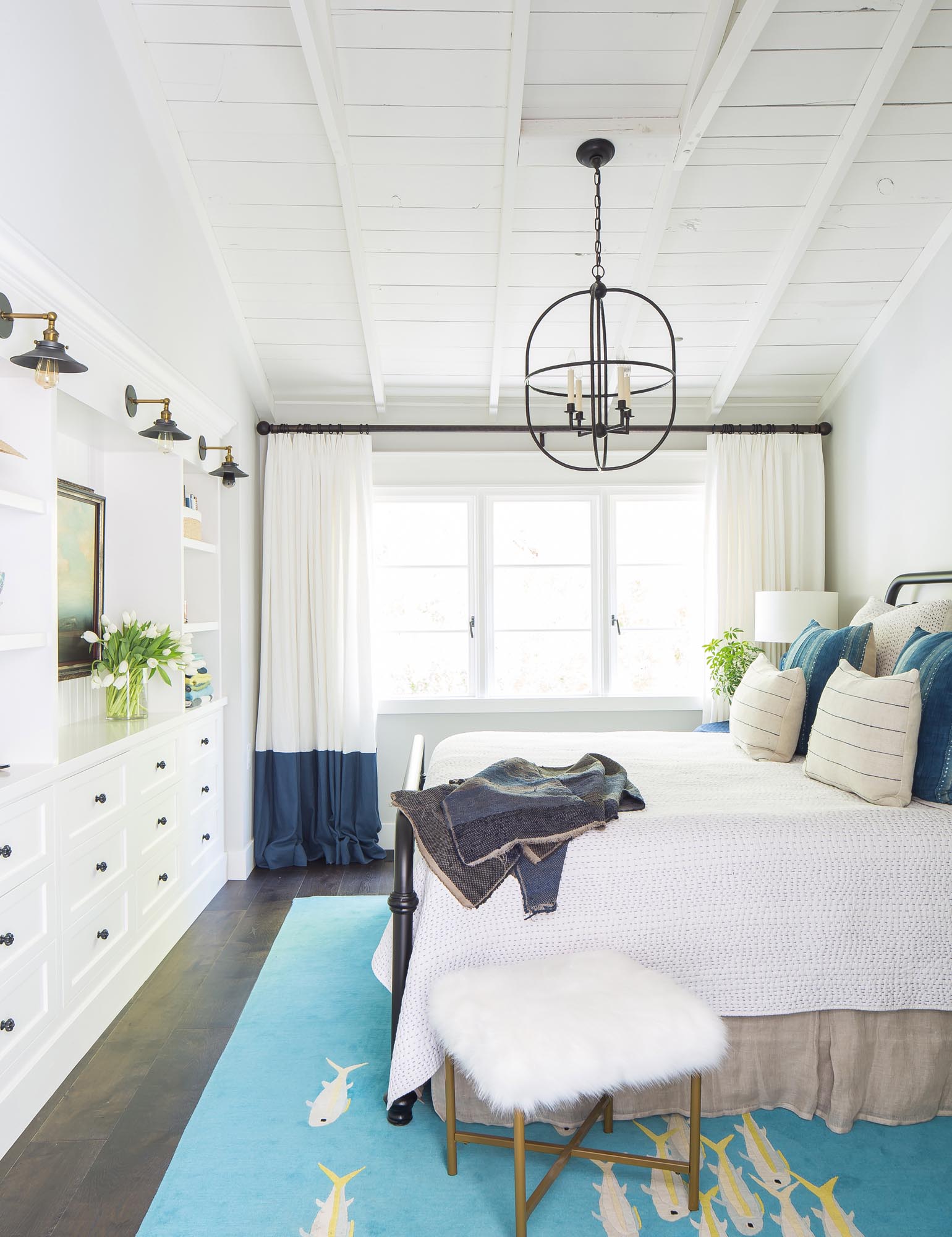 Neptune and the sea inspired this beautifully decorated master bedroom.