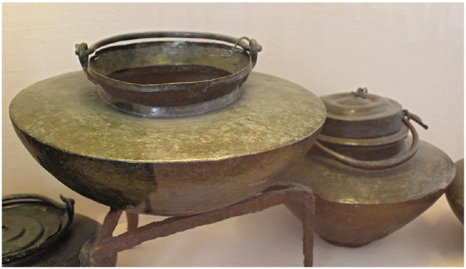 Figure 3.4. Bronze Roman cooking pots, of the type used by a more affluent household or a food vendor (National Archaeological Museum, Naples)