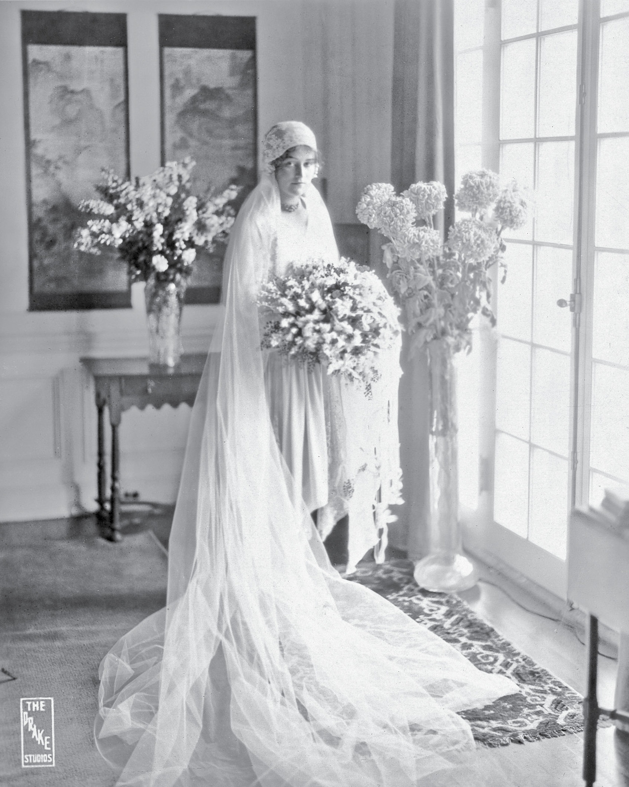 Alicia in white satin and lace before her Lake Forest wedding to Jim Simpson, 1927.