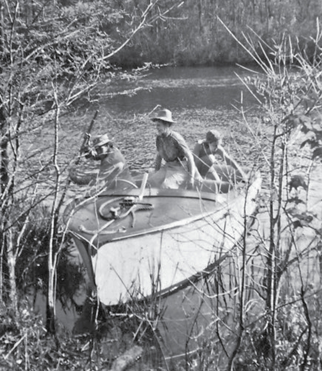 Alicia, sister Josephine, and Janet Hauck try to push their speedboat away from the bank of the St. Mary’s River, Georgia.