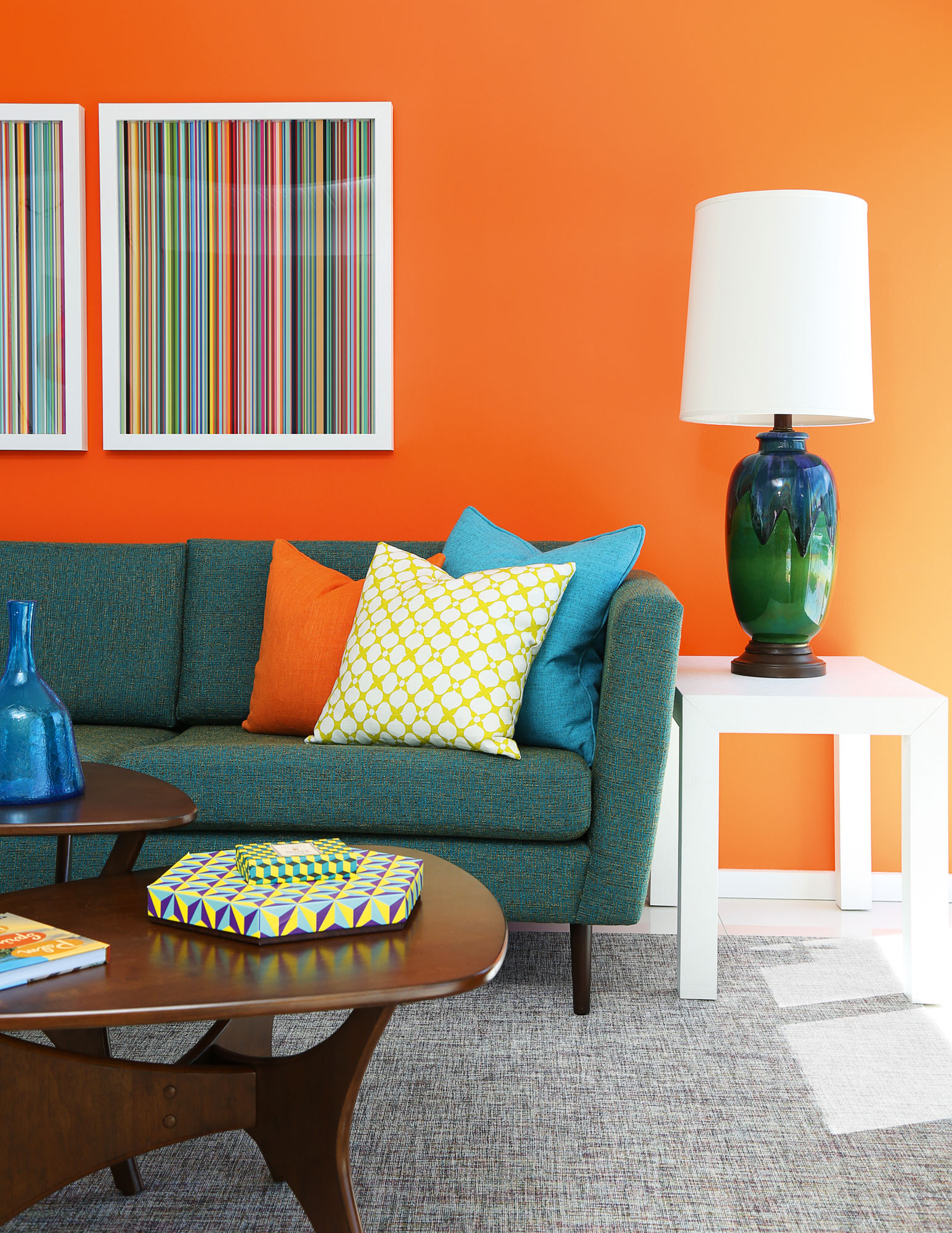 Photo of living area with orange wall.