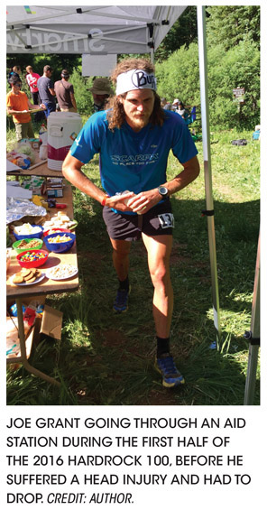 JOE GRANT GOING THROUGH AN AID STATION DURING THE FIRST HALF OF THE 2016 HARDROCK 100, BEFORE HE SUFFERED A HEAD INJURY AND HAD TO DROP. CREDIT: AUTHOR.