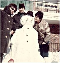 Building a snowman in our Bensonhurst front yard. Zipi with our friends Chulu and Geula Waldman, 1969