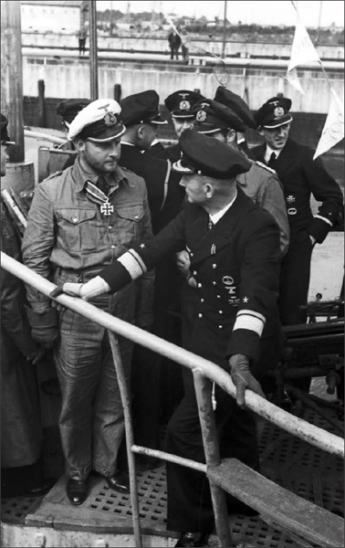 Fritz-Julius Lemp and Admiral Karl Dönitz on the deck of the U-30 at the U-boat base at Wilhelmshaven in August 1940