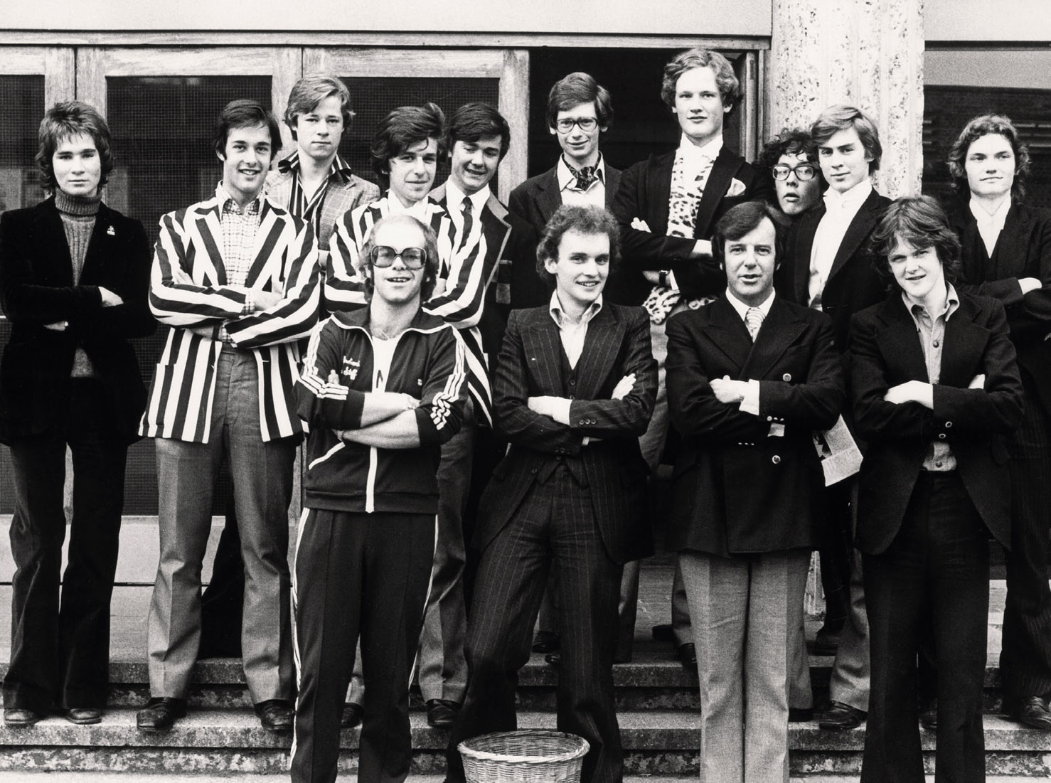 Strangely random photograph of Elton John and the chat show host Russell Harty, photographed at Eton during a celebrity visit. NC and Craig Brown front row. Back row includes Guy Lubbock, James Colthurst, Desmond Monteith, Jamie Robertson, Percy Weatherall, Chris Figg, John Montagu Douglas Scott. Photograph by Terry O’Neill.