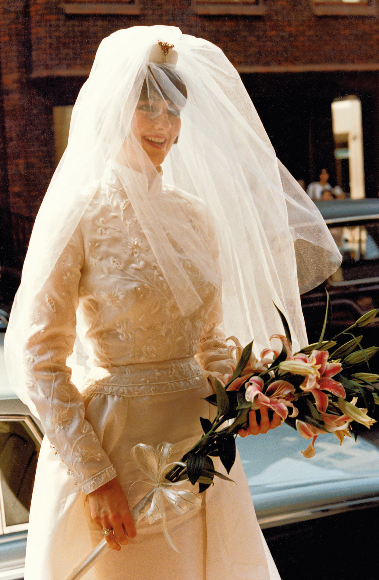 Georgia Coleridge on her wedding day, photographed on the steps of St George’s Church, Hanover Square, around the comer from Vogue House. The dress is by Alistair Blair. Photograph by Anthony Osmond-Evans.