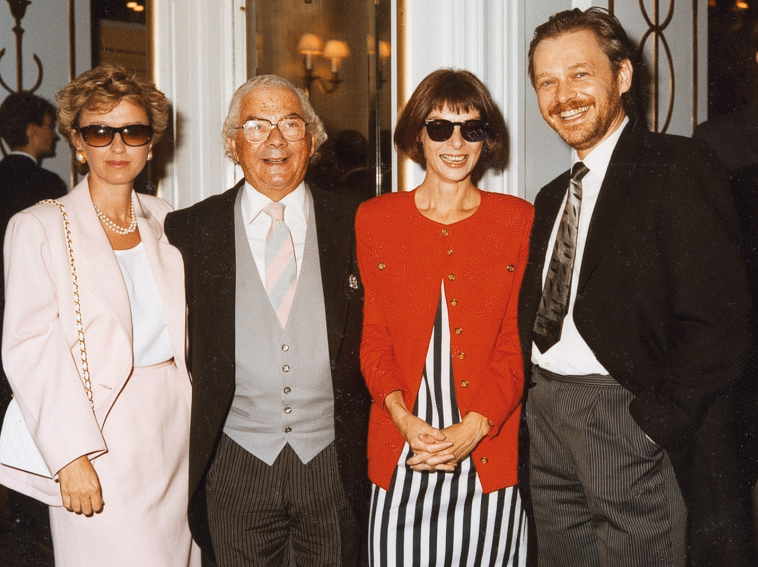 Tina Brown, Editor-in-Chief of Vanity Fair, Bernie Leser, President, Condé Nast Inc., Anna Wintour, Editor-in-Chief, American Vogue, Miles Chapman, VF headline writing genius, at the Coleridges’ wedding reception at Claridge’s. 22 July 1989.