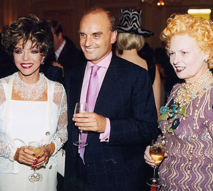 With Dame Joan Collins and Dame Vivienne Westwood. By a strange algorithm of placement, NC often found himself seated next to Dame Joan at dinners.