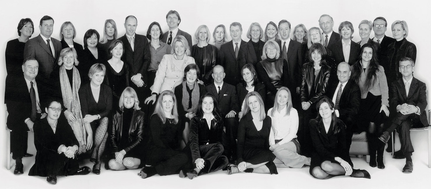 Editors, Publishers, Executives and managers of Condé Nast Britain, photographed school group-style in the late nineties. The 40 people in the picture served a total of a thousand years for the company.