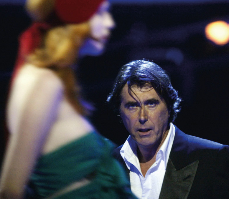 Bryan Ferry performing ‘Let’s Stick Together,’ while Karen Elson struts by.