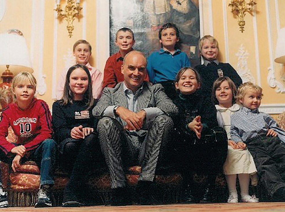 A shameless promotion for his 2002 novel Godchildren, NC is photographed in a suite in Claridge’s, with five of his seven godchildren, and his own children. Front row: Cara Delevingne, Helena Allan, NC, Ione Hunter Gordon, Sophie and Tommy Coleridge. Back row: Alexander Coleridge, Ewan Wotherspoon, Freddie Coleridge, Ned Donovan. Photograph by David Ellis.