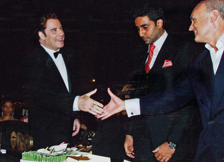 John Travolta and NC at an Indian GQ Men of the Year Awards dinner, Bombay. Travolta flew himself to India in his personal 747, but his ‘wig carrier’ flew separately with the extensive collection of toupées.