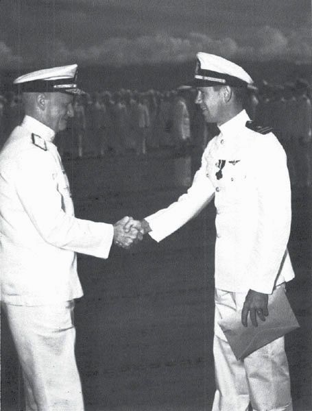 Lt. Louis Bauer, CO of VF-6, receives the Navy Cross from Admiral Nimitz, 15 Oct. 1942. (NA 80-G-17230)