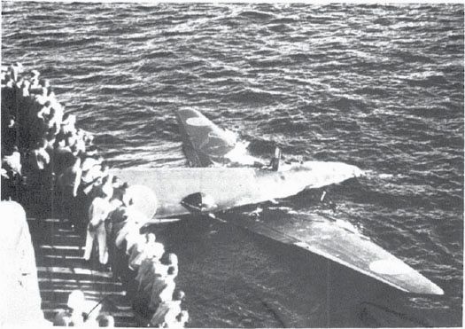 Ditched Type 1 land attack plane alongside the Bagley, 8 Aug. 1942. Japanese crewmen had fired their pistols at the destroyer before being killed. (NA 80-G-K303)