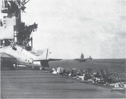 Looking from the Wasp to the Saratoga and the Enterprise beyond, 12 Aug. 1942. VF-71 Wildcat F-8 (BuNo. 5033) went down with the Wasp on 15 September. (USN)