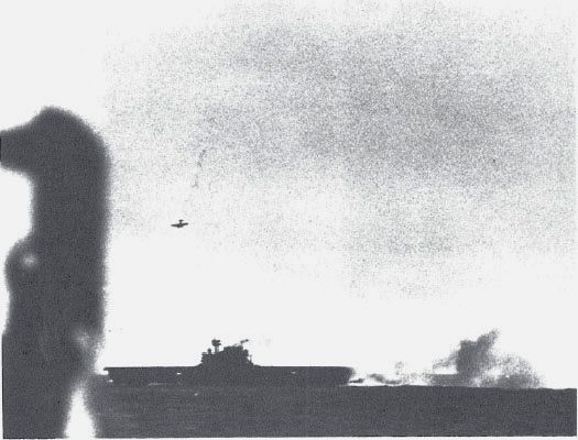 Japanese carrier bomber diving against the Enterprise, 24 Aug. 1942, as seen from the Portland. (NA 80-G-299801)