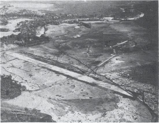 Henderson Field from the south, about 23 Aug. 1942. The Pagoda is in the center, and the Lunga River on the left. (NA 80-G-16312)
