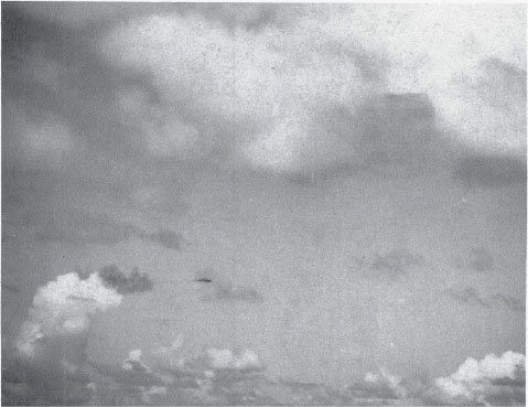 The end of a Samurai. Lt. Cdr. Murata Shigeharu’s Shōkaku Type 97 carrier attack plane (with elaborately marked tail) smokes