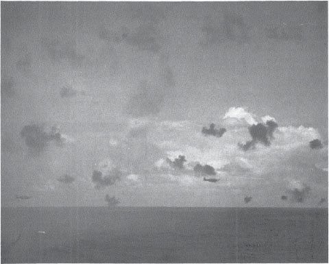 Shōkaku Type 97 carrier attack planes flown by PO2c Kodama Kiyomi (l) and PO2c Miya Tatsuhiko (r) attack from astern of the Hornet.