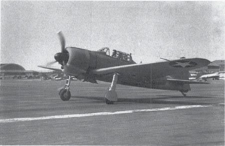 Lt. Cdr. Eddie Sanders taxis the captured Zero fighter at San Diego, September 1942. (NA 80-G-12777)
