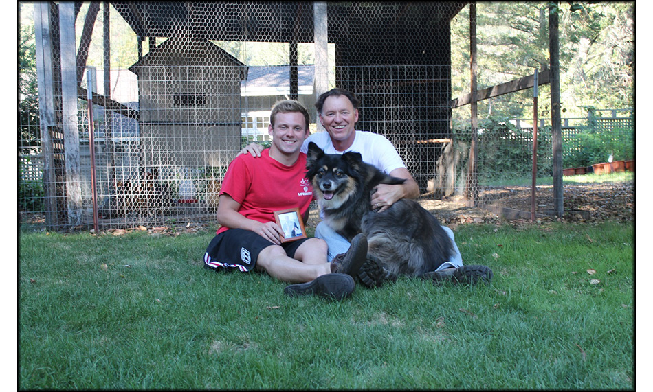 Alex, Paul, and Ella relaxing in St. Helena with the framed picture of Fran Crippen