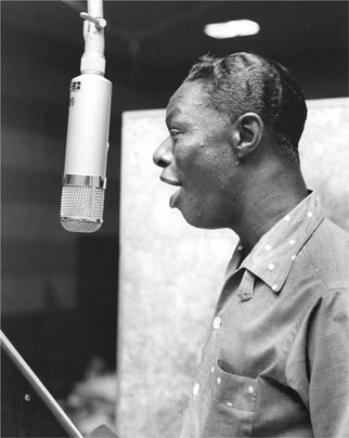 FIGURE 12.1 Nat “King” Cole records a mellow 1950s ballad. Courtesy of Photofest.