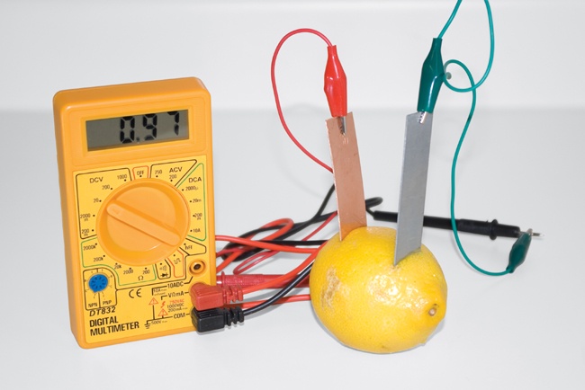 Measuring the voltage produced by an electrochemical cell with copper and zinc electrodes (note that the actual voltage is lower than the theoretical 1.10V)