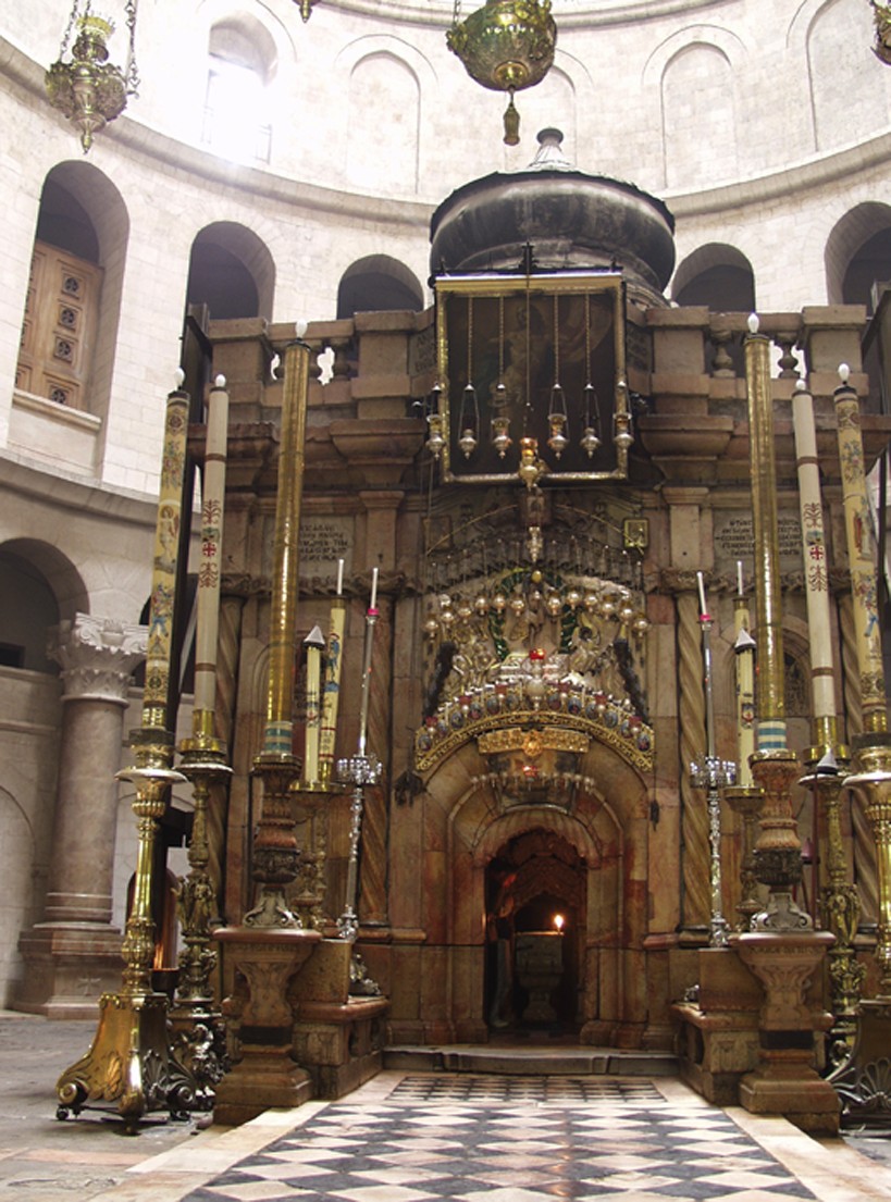 Figure 24-3: The holiest site in Christianity, Jesus’ empty tomb is commem-orated within this stone monument located in the Church of the Holy Sepulcher.